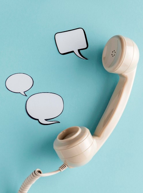 top-view-chat-bubbles-with-telephone-receiver-copy-space-1.jpg